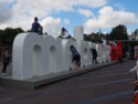 Rear view of people climbing on the I amsterdam sculpture