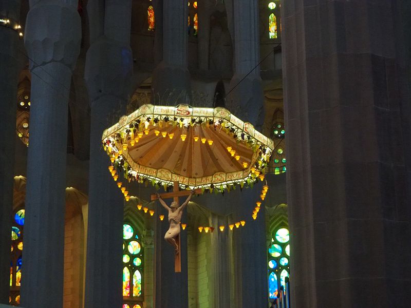 Crucifixion hanging under an umbrella