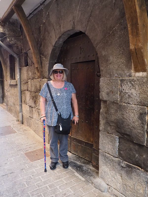 Linda next to a very old door