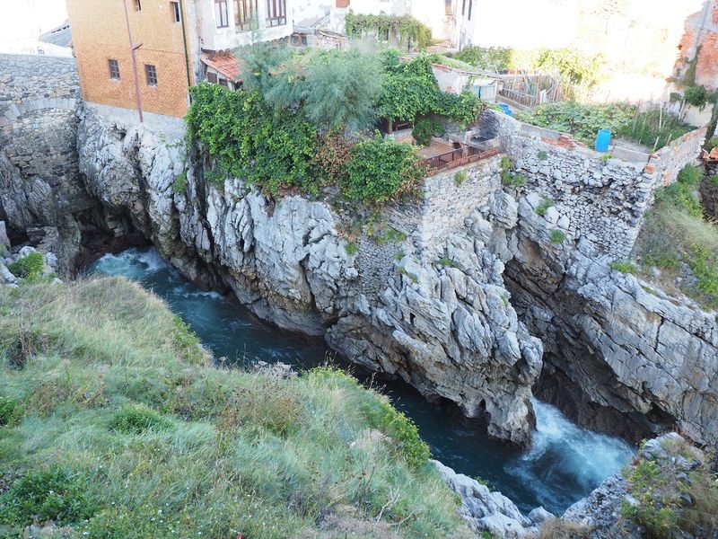 Rocky inlet with houses perched on top