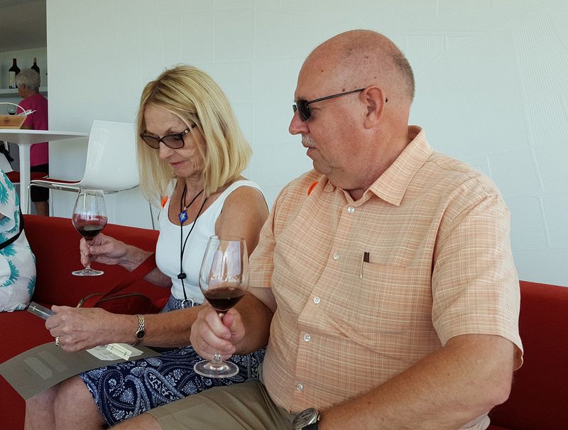 Eloise and Pete tasting the wine