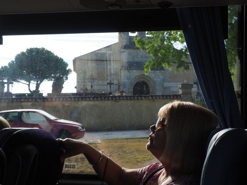 Linda looks out the window of our bus