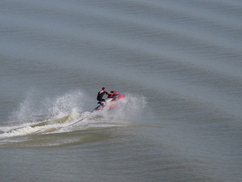 Jet skiers enjoy jumping our wake