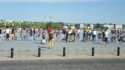 Lots of people wading in a reflecting pool