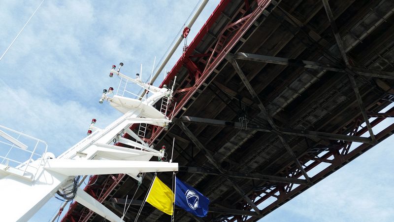 The ship's antenna barely misses hitting the bridge