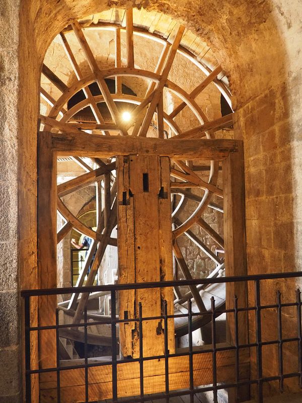 A giant hamster wheel for people for pulling up the supplies on the slide outside