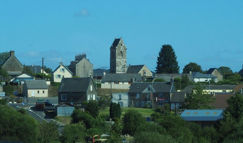 Sainte Mere-Eglise where a paratrooper's chute caught on the tower during WW2