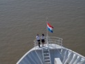 Two crew members at the bow of the ship