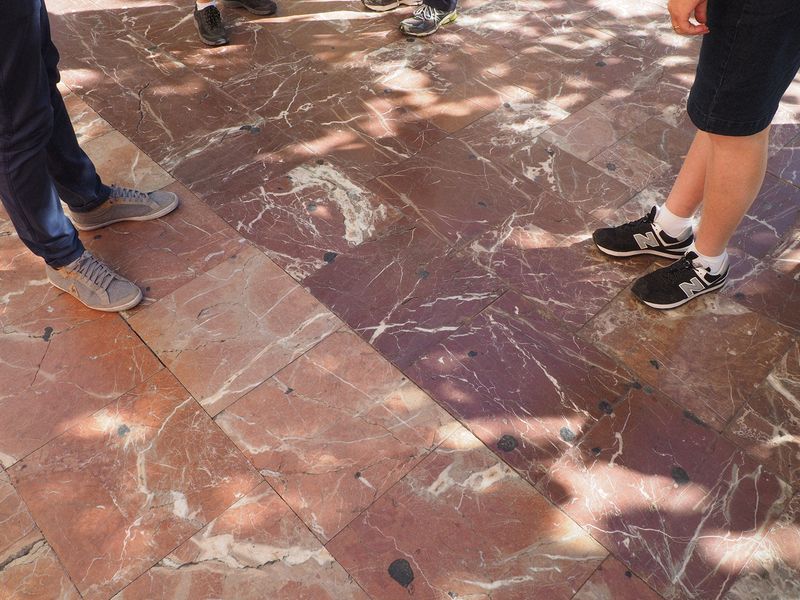 The sidewalk is made from marble