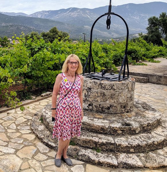 Eloise next to an old well