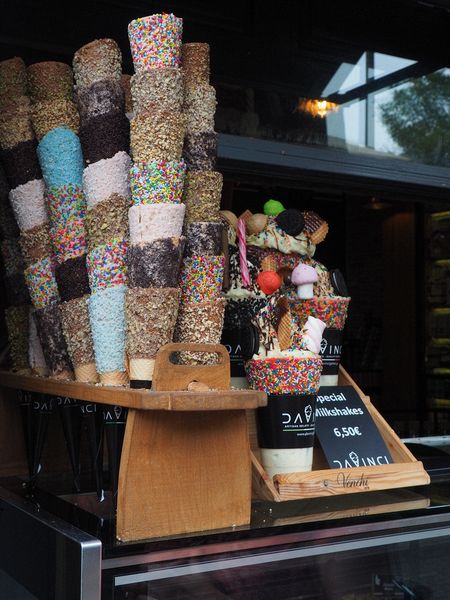 Ice cream cones covered with various sprinkles