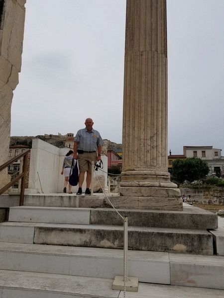 Pete next to a column