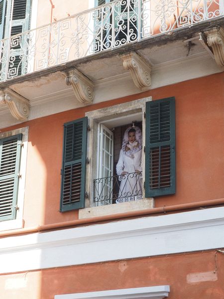 A cardboard bride is in this window