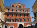 An old buildings with cardboard models in some windows