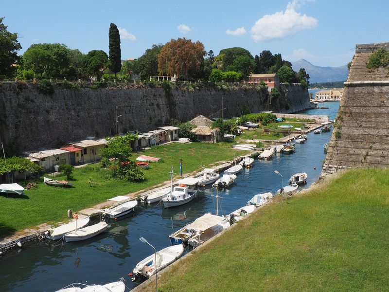 The fortress moat is full of small boats and fishing shacks