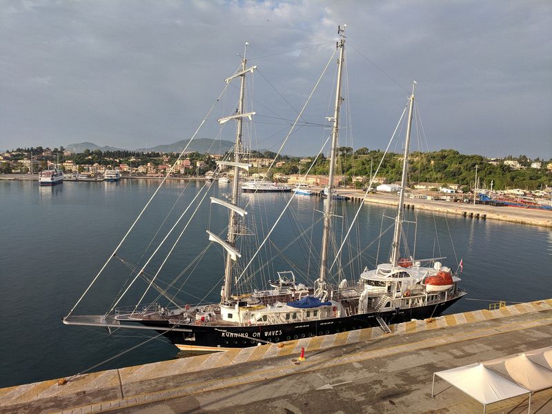 The sailing ship Running on Waves is docked next to us