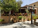 Lots of geraniums in pots on this restaurant