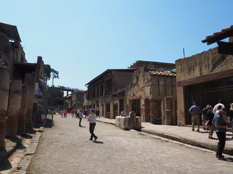 A wide street lined with stores