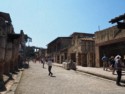 A wide street lined with stores