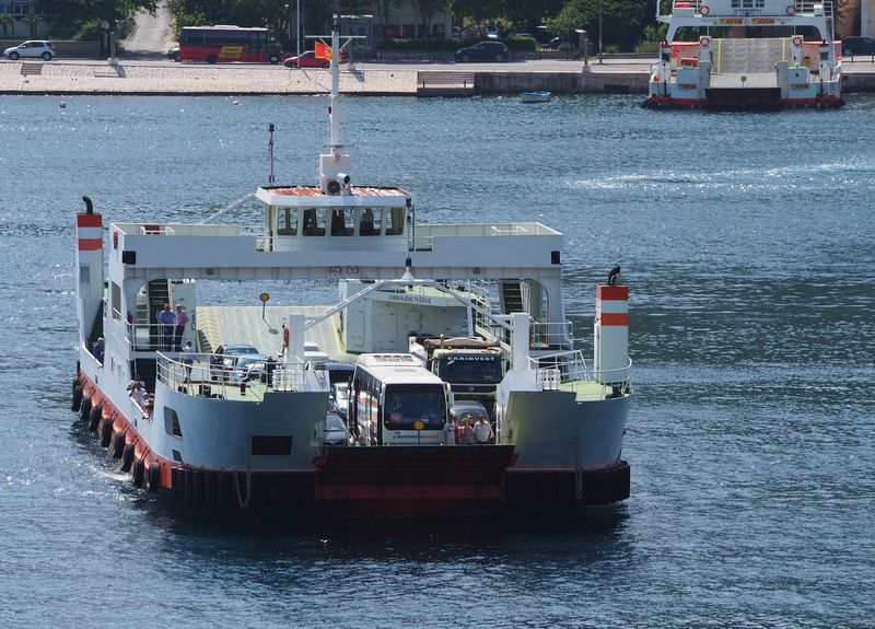 A ferry with lots of vehicles