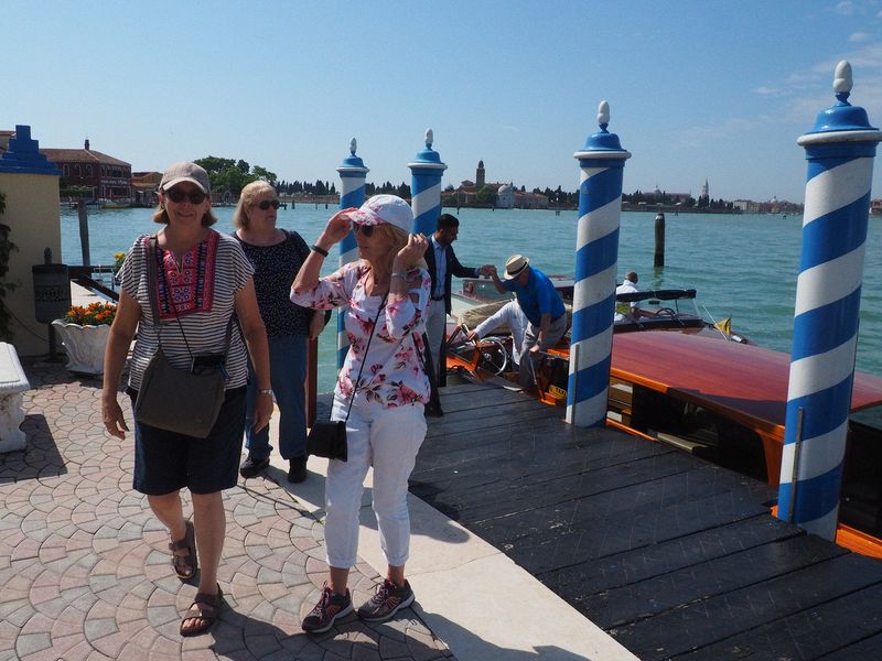 June, Linda, Eloise, and Livingston disembark from the water taxi