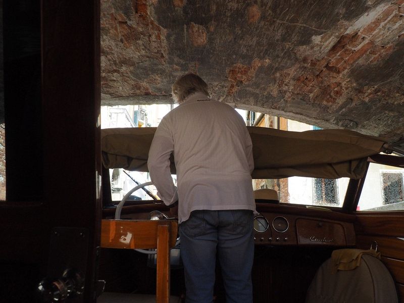 The water taxi goes under a low bridge