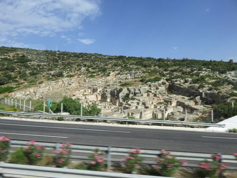 We pass ancient ruins beside the road