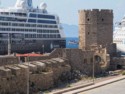 Ruins of a medieval tower next to the ships