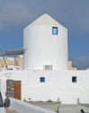 An old windmill has been converted into a round house