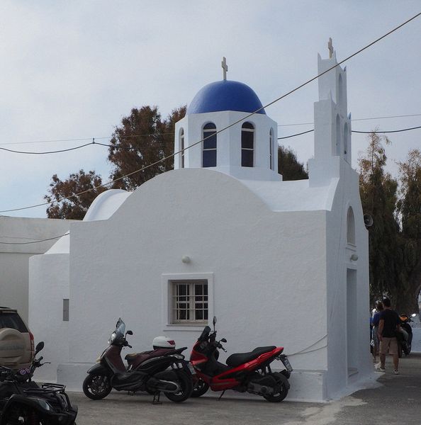 A small church with a blue dome