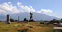 An armless statue overlooks the valley below