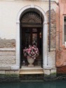 A bouquet in an entryway on a canal