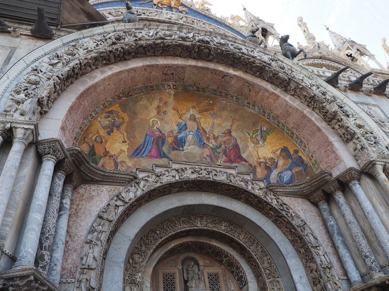 A mosaic above a door into St Mark's Basilica