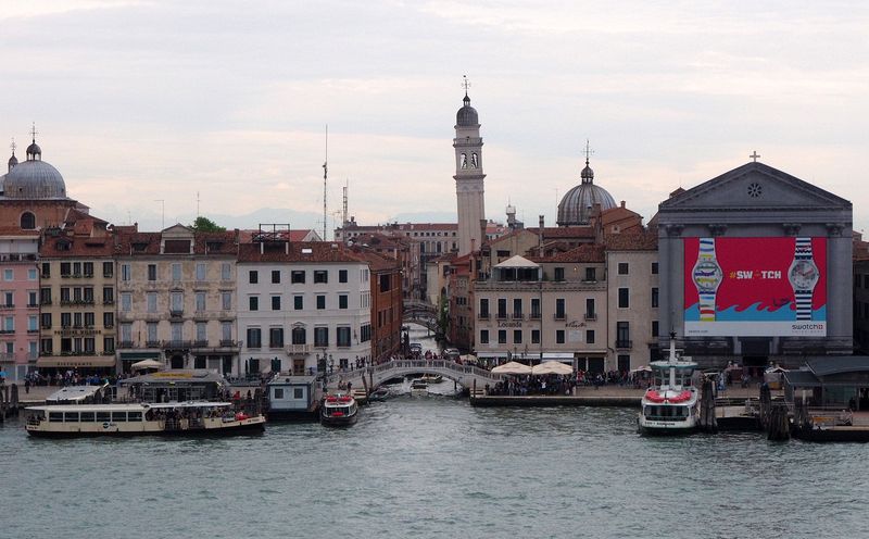 Chiesa San Giorgio dei Greci and Chiesa della Pieta with Swatch billboard