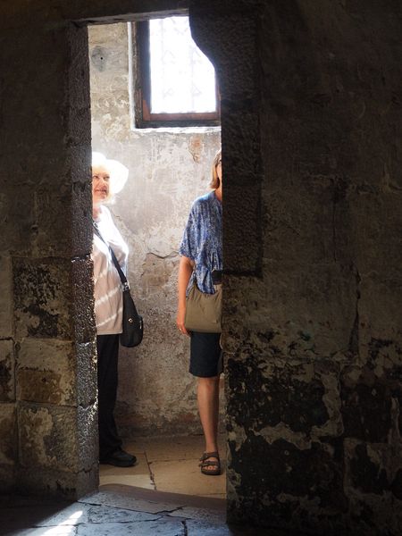 Linda and June at the doorway to a cell