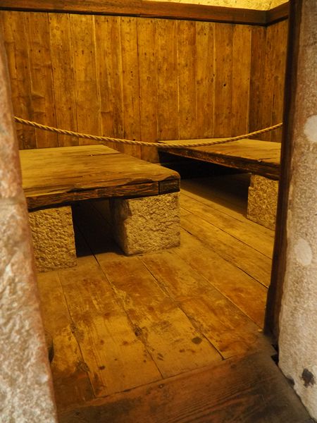 Wooden beds in a prison cell