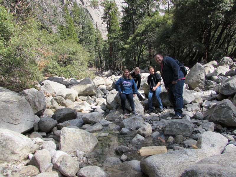 The family in a rocky stream bed
