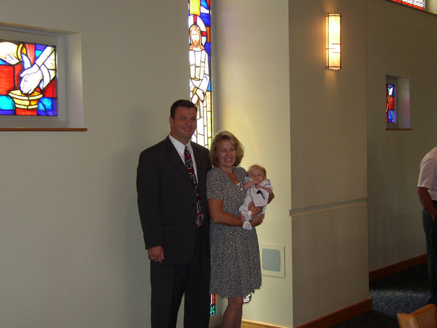 133-Andrew with his god parents 2