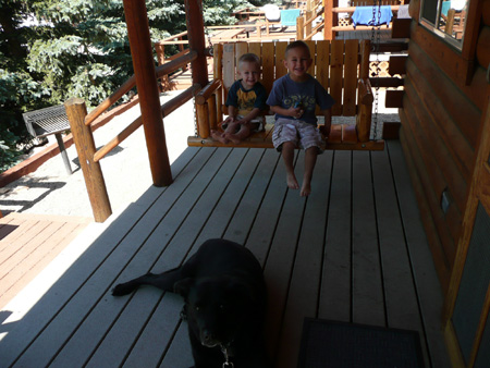 096 Andrew nicholas and hunter on cabin porch