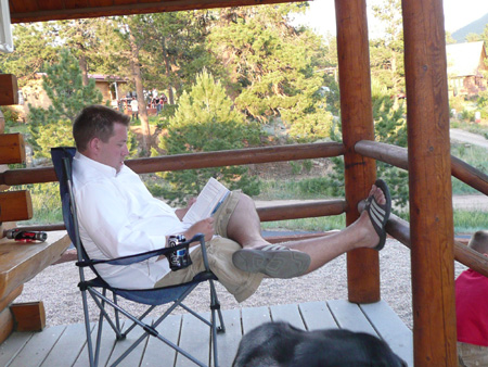 190 dave reading on cabin porch