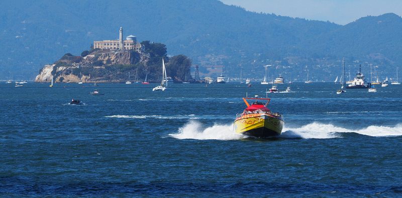 A fast jet boat with Alcatraz in the background