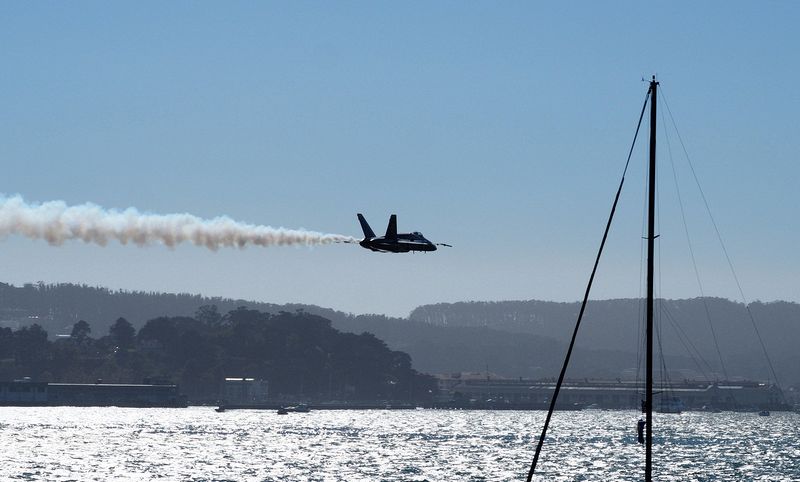 A lone Blue Angel buzzes low over the Bay