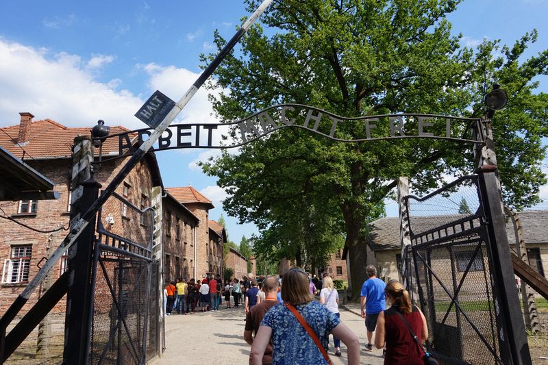 Entering  Aushwitz concentration camp under the famous 'Arbeit Macht Frei' sign