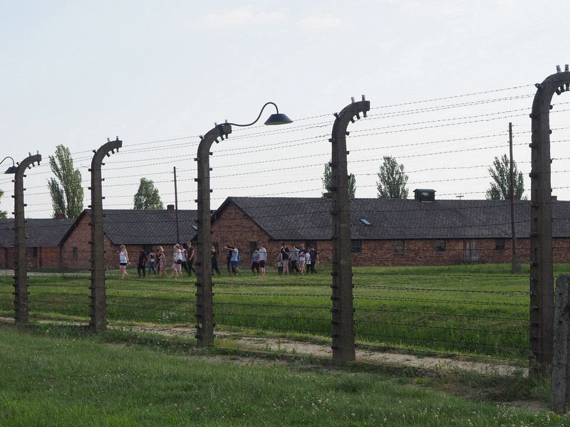 People walking amongst the guard's barracks