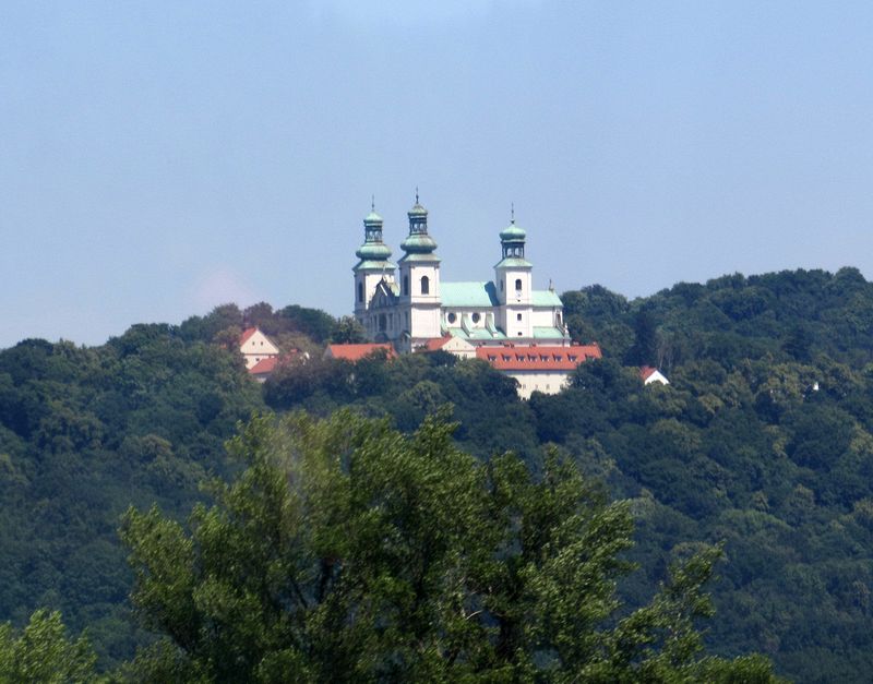 We pass a monastery in the hills