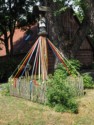 Shrine with colorful streamers tied to the fence