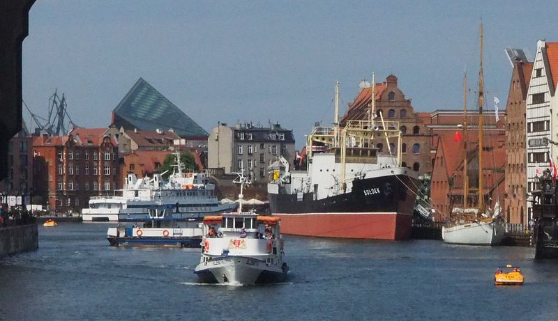 Our hotel is behind the black and red ship