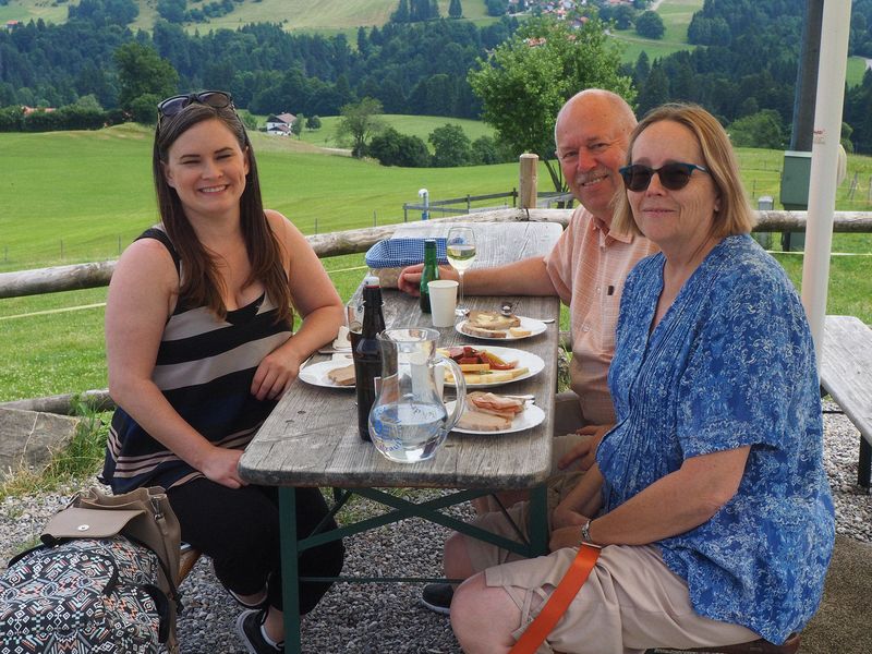 Jessica, Pete, and June share a lunch of local bread, cheese, and sausage