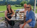 Jessica, Pete, and June share a lunch of local bread, cheese, and sausage