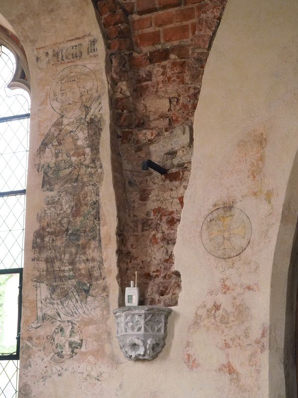 Old wall paintings and exposed brick